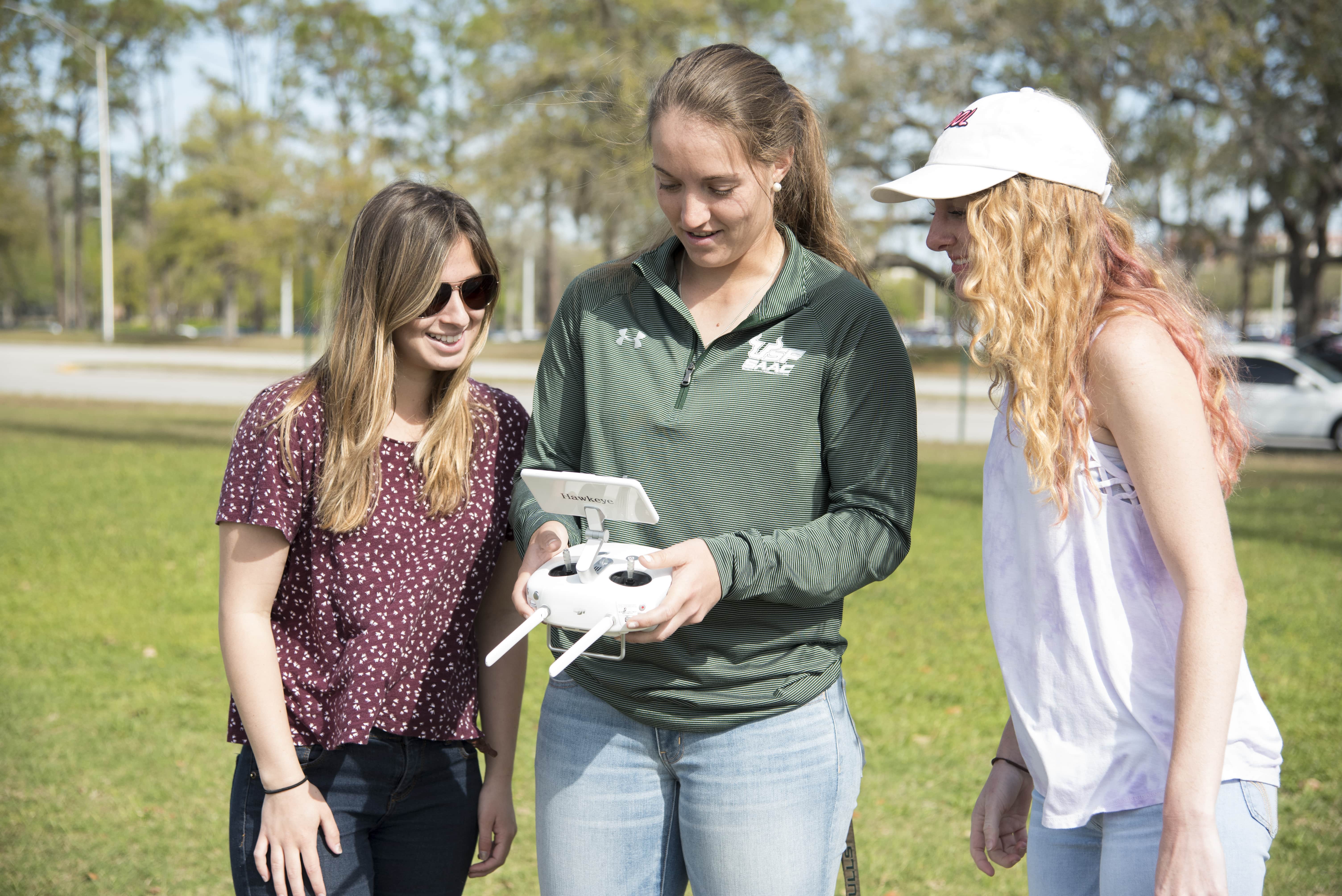 campers using a drone at drone camp