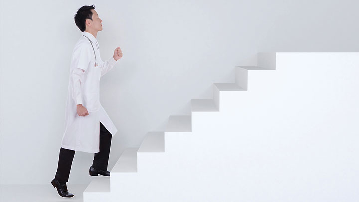 Doctor walking up stairs