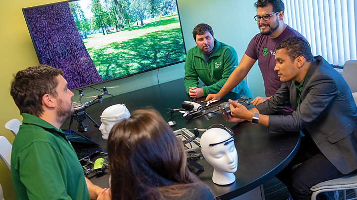 Andujar meeting with USF students in his Neuro-Machine Interaction Lab