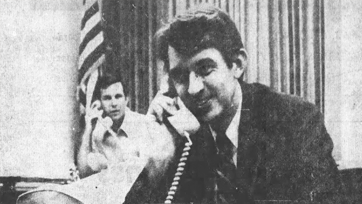 Black and white photo of Tomaino on the phone