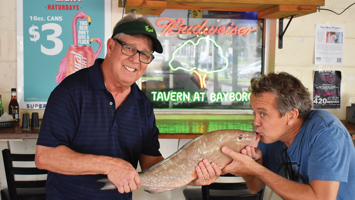 Tom Herzhauser holding a fish with Dennis Bixler
