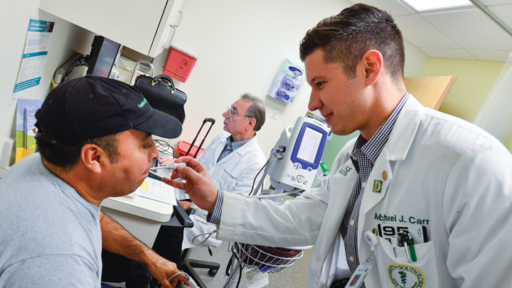 USF medical student helping a patient
