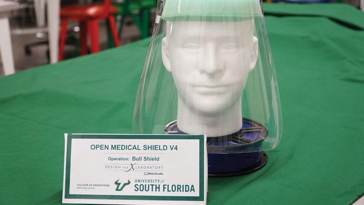 Engineering designed mask on mannequin head with a green background
