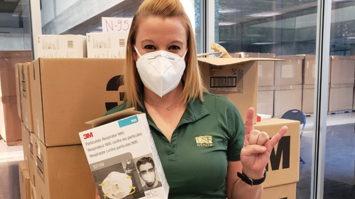 Elizabeth Dunn takes inventory of N95 face masks for the Hillsborough County Office.