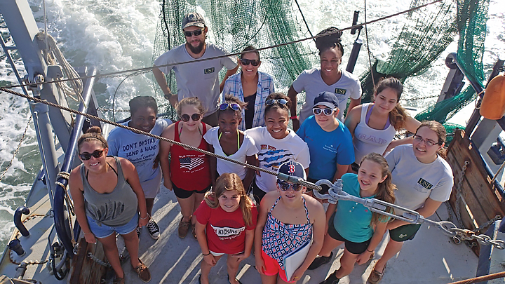 A group of girls and aboard ship in 2016