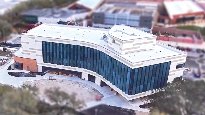 Aerial photo of the nearly completed USF Wellness Center, facing east toward the Yuengling Center on the Tampa campus.