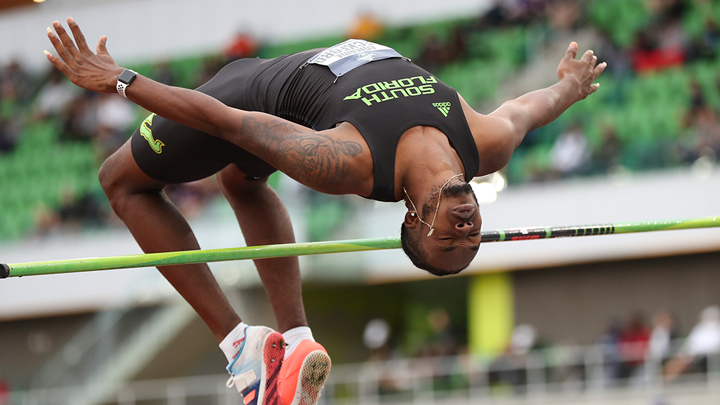Romaine Beckford executes a picture-perfect high jump.