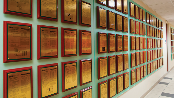 View of USF’s ‘patent wall’ in the Research Park on the Tampa campus. Hundreds of plaques representing USF’s patents.