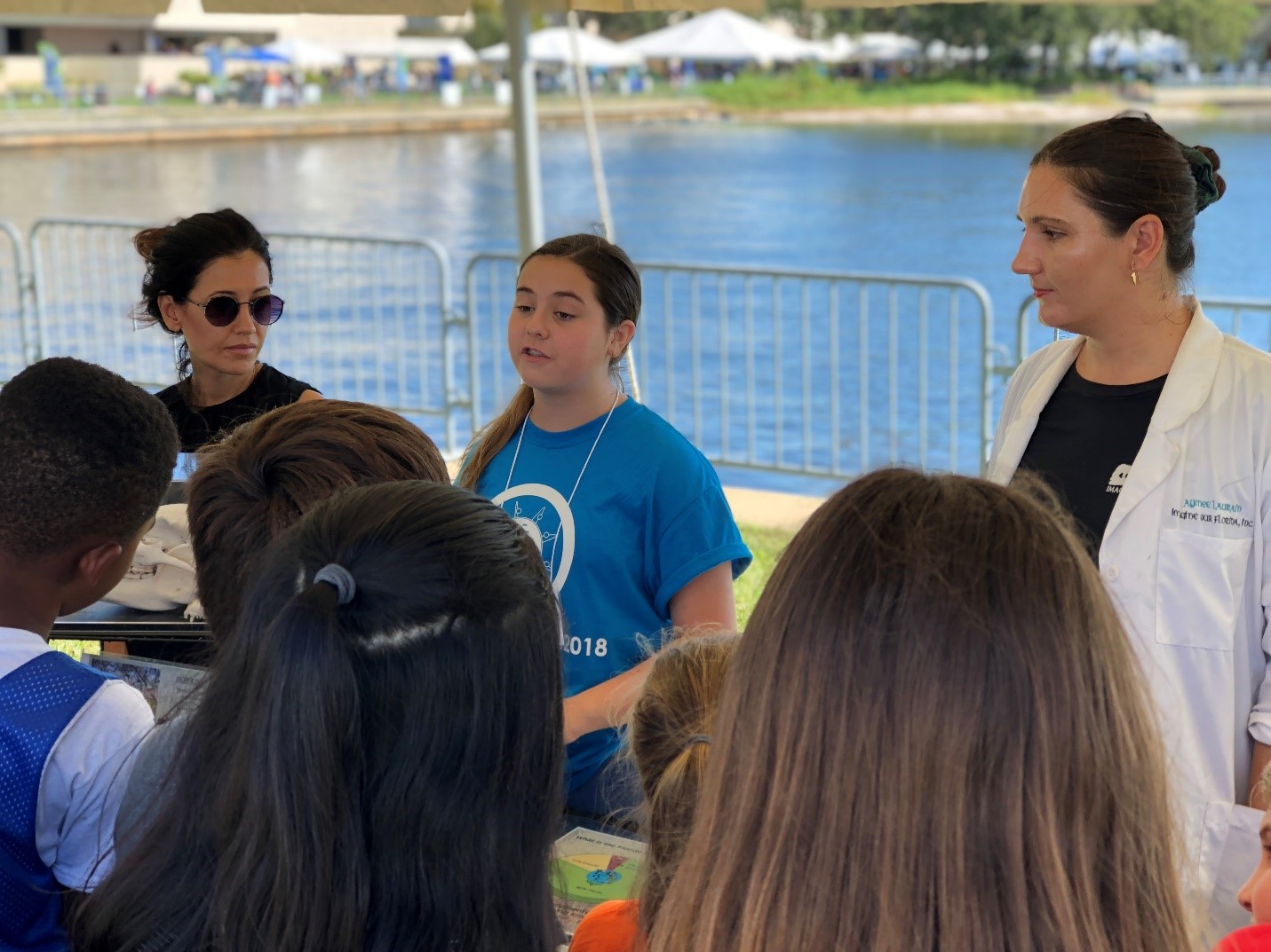 A Junior Scientist explains the diet of Florida black bears at the Imagine Our Florida, Inc. booth during the 2018 St. Petersburg Science Festival. 
