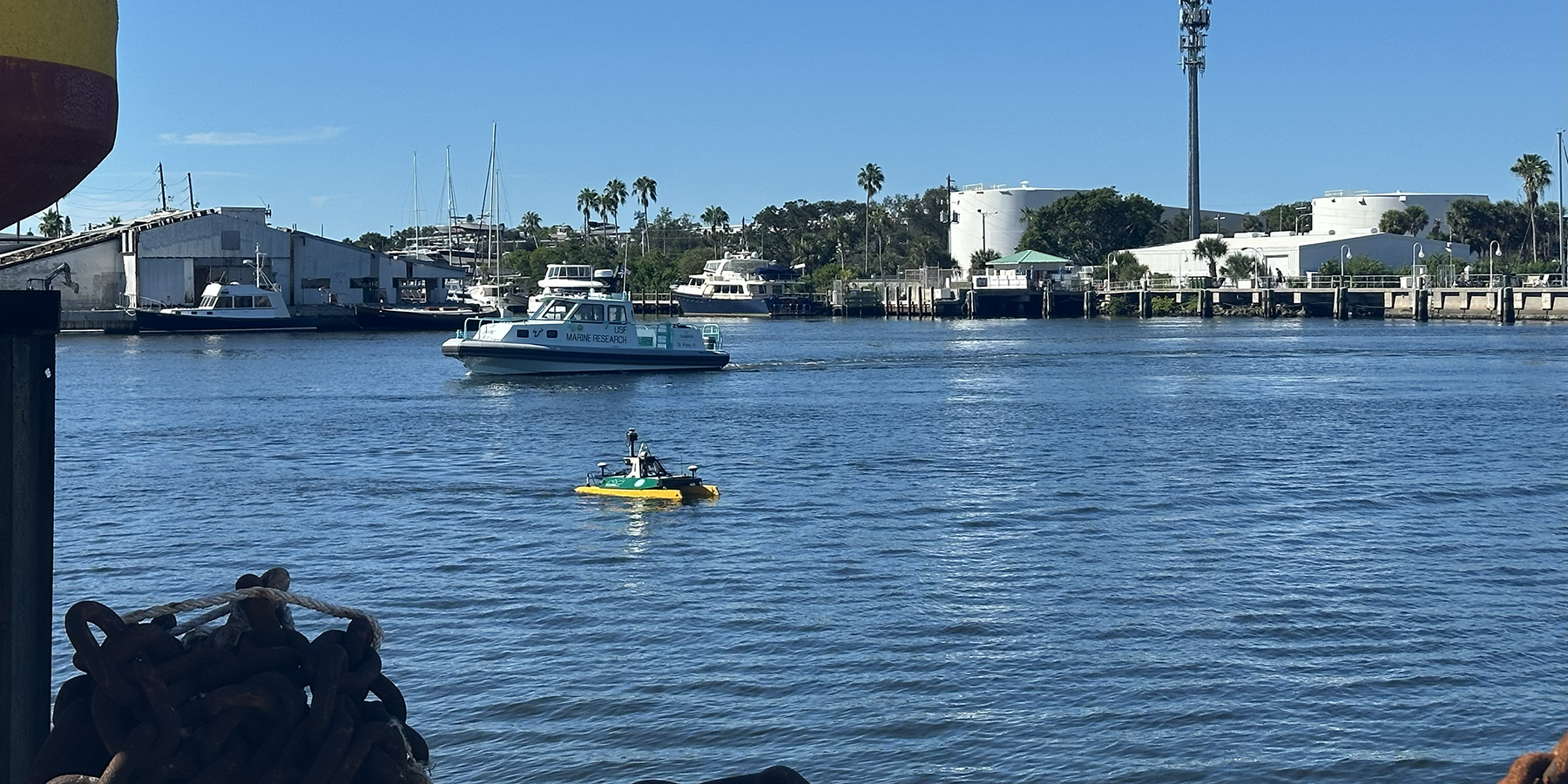 A new uncrewed surface vehicle named EMMET (Enhanced Mobile Mapping with Emerging Technologies), seen in the foreground during a recent demonstration day at the USF College of Marine Science. Photo by Carlyn Scott.