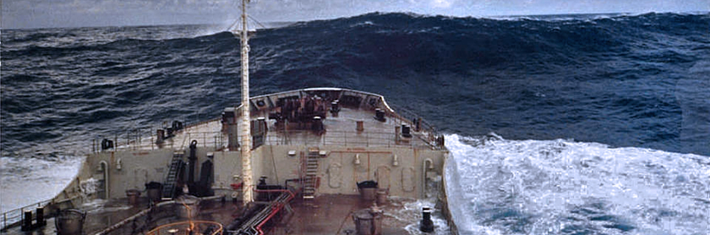 A ship approaches a rogue wave, estimated to be 18.3 meters (60 feet) off Charleston, South Carolina. Rogue waves are unpredictable, dangerous, and huge - at least twice the height of surrounding waves. Photo courtesy of NOAA. 