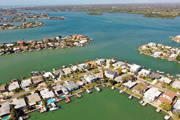 Aerial drone photo of the neighborhood in Redington Beach. Some scientific forecasts of rising seal levels project that a 2-foot rise would leave parts of the town underwater by 2100. But there are much more pessimistic forecasts out there. Photo Credit: Luis Santana | Times. 