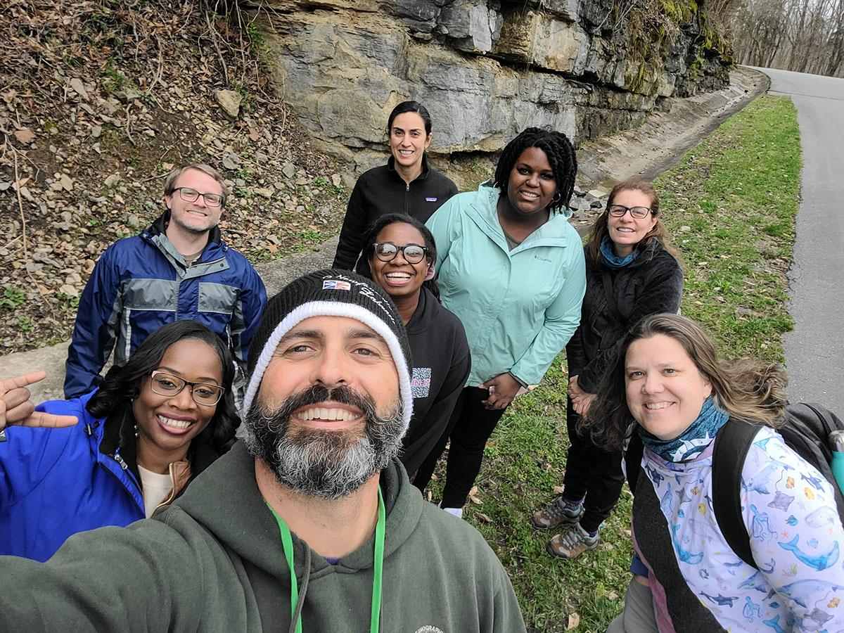 Both USF and Salsbury University All-Aboard teams take a selfie in front of Ragland Bottom Center Hill Lake in Sparta, TN during a group geology scavenger hunt. 