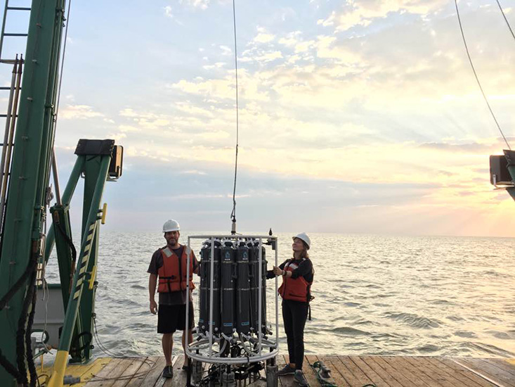 Lead author Dr. Anni Djurhuus (right) from the University of the Faroe Islands (formerly USF College of Marine Science) and coauthor Dr. Enrique Montes (USF College of Marine Science) manage the Rosette water sampler. All scientists need to perform a marine eDNA study of this sort is about a liter of water. 