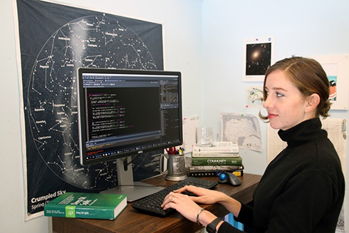 Bea Combs-Hintze, PhD student at her desk at USF CMS, creating digital ecosystems.