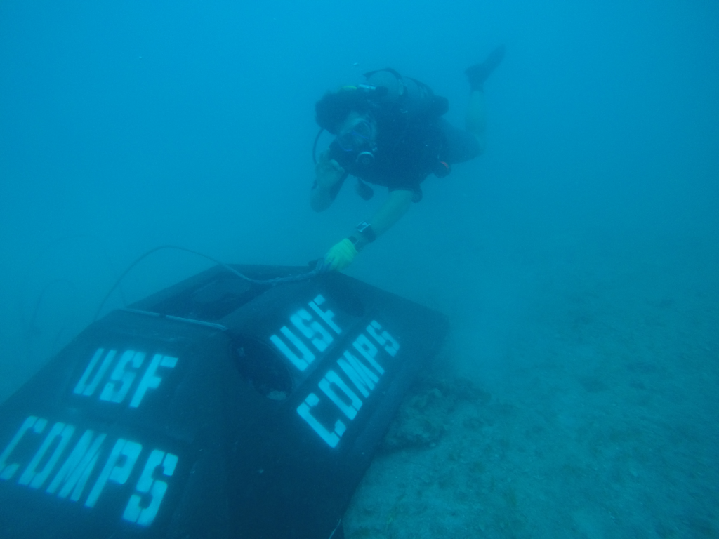 Ben Meister detaches a lifting harness from an acoustic Doppler current profiler bottom mount in Rebecca Shoals. Photo: Jay Law