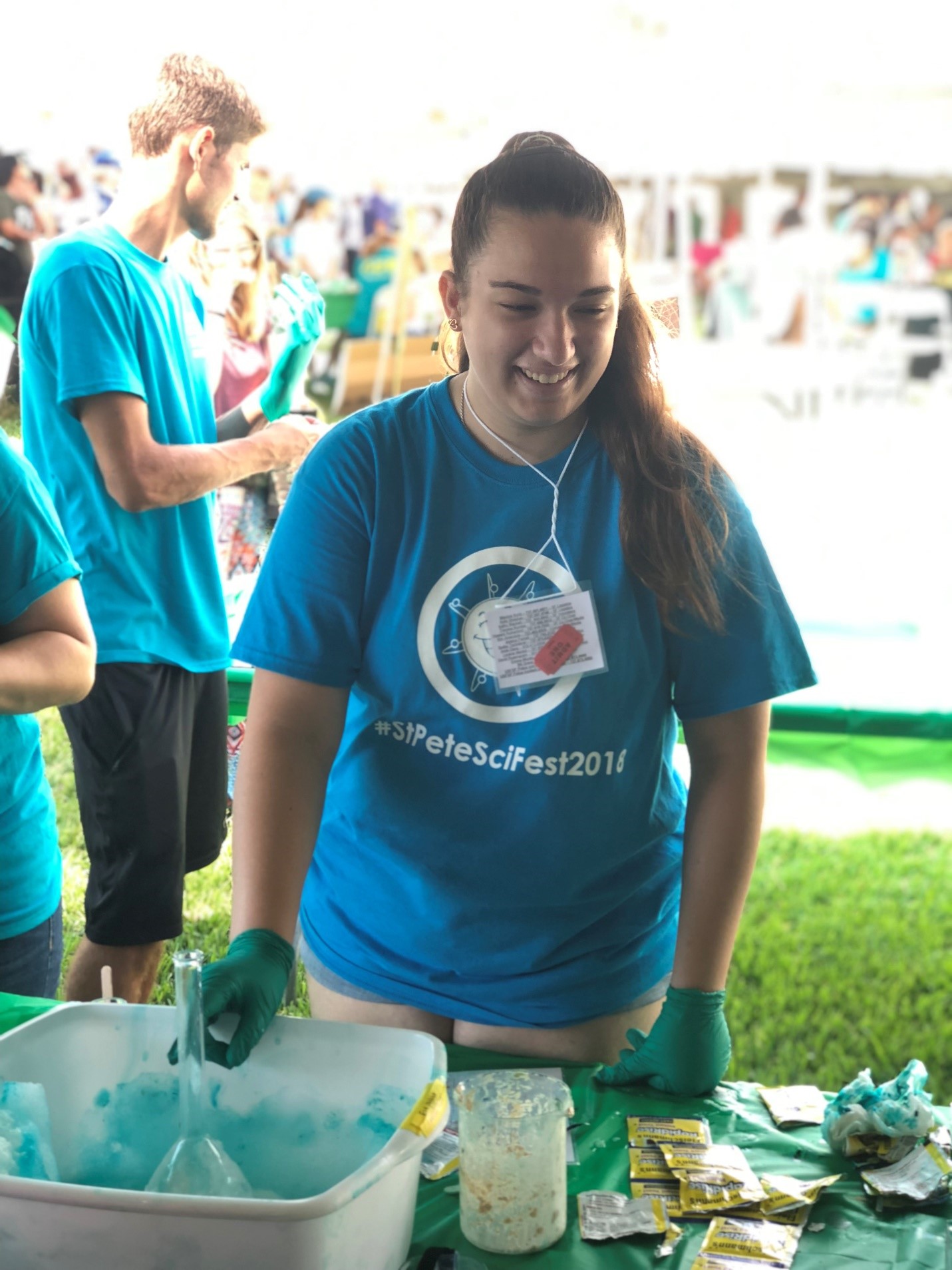 Bibiana Bellora, a Junior Scientist, works the chemical reaction table at the USFSP pavilion during the St. Petersburg Science Festival.