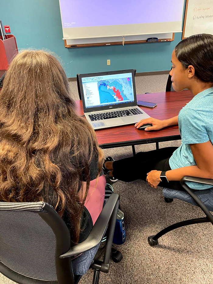 Campers Ava and Jaleyah using ArcGIS to create their own Marine Protected Area.