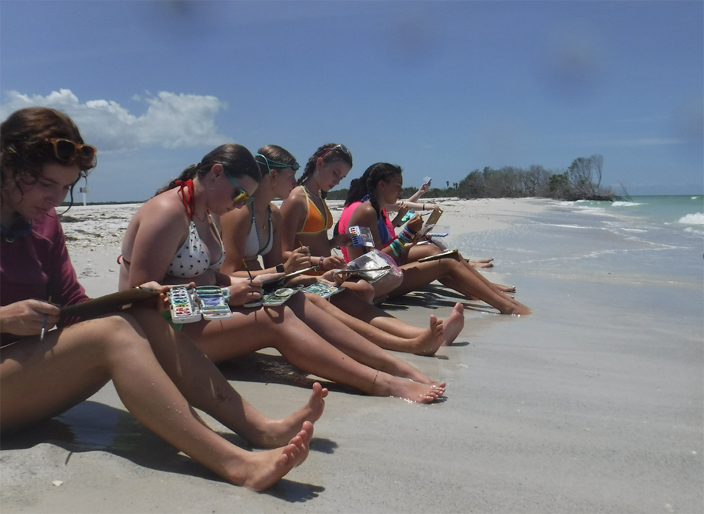 Campers doing beach water color paintings while at Shell Key. 