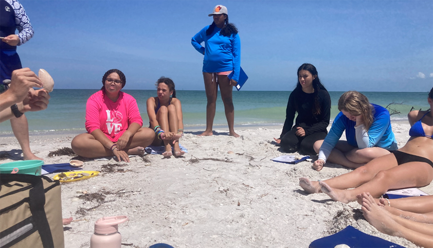 Campers listen to “Shell and Tell”, where each camper finds their favorite shell on the beach of Shell Key and gets to tell everyone why it’s their favorite, but with their new-found knowledge about gastropods and bivalves. 