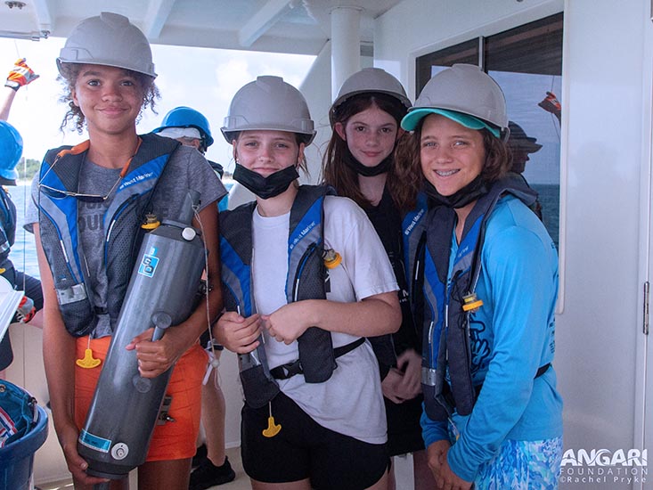 Campers Olivia, Evelyn, Victoria, and Payton with the Niskin bottle. Photo credit: Rachel Pryke, ANGARI Foundation.