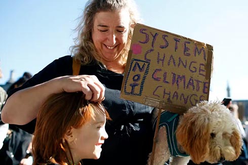 Learning to stay connected through relationships in a compassionate way is critical in navigating climate change. (AP Photo/David Cliff)