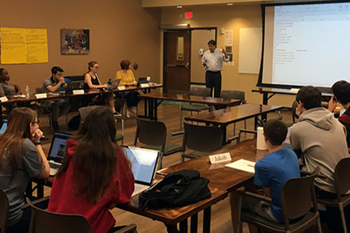 Dr. David Naar explains some related geological concepts to the estuaries honors class.