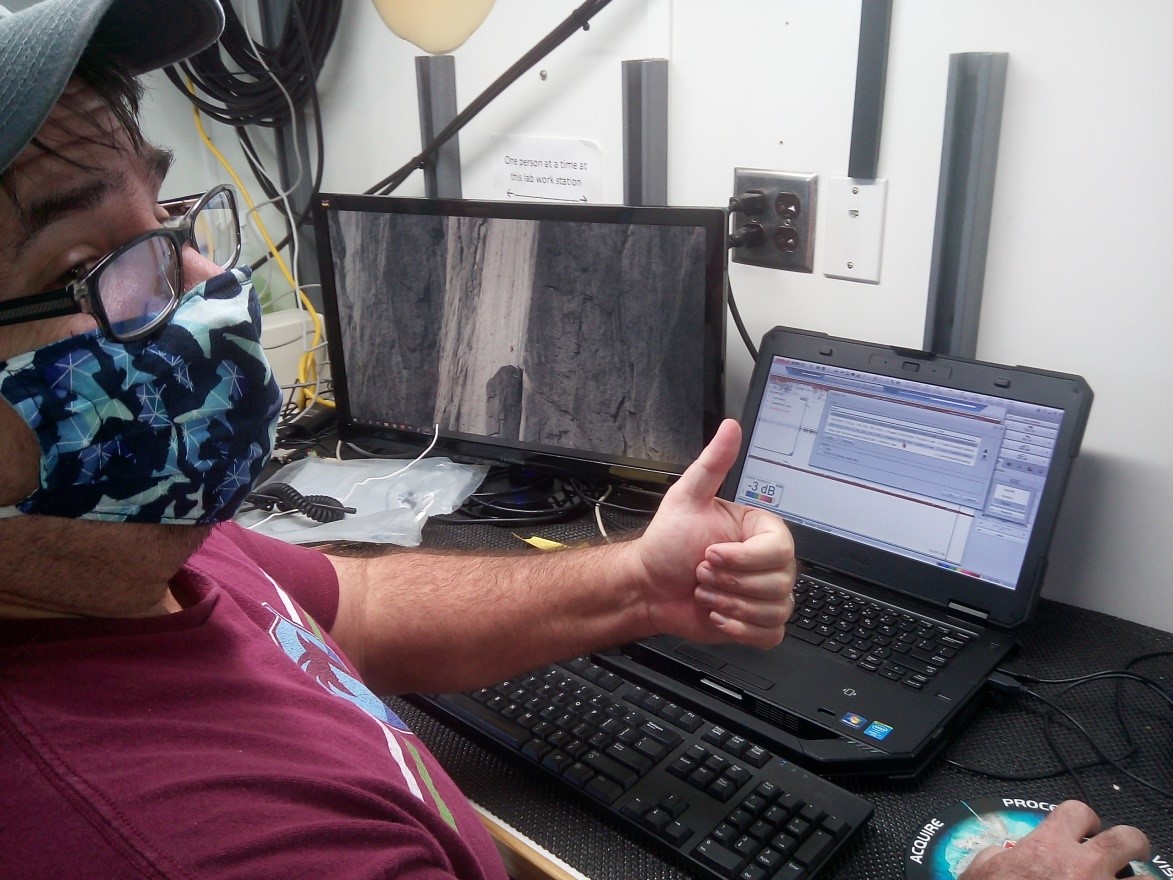 Eddie Hughes gives the thumbs up to the camera, indicating desired calibration readings.