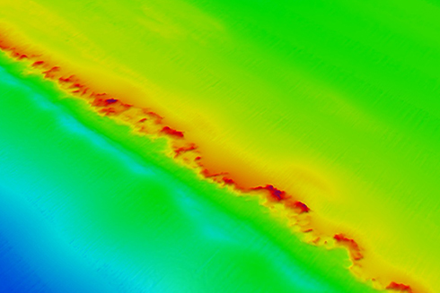This is a bathymetry map of The Elbow, a popular fish hangout, that was collected by the USF College of Marine Science (USFCMS) team. The Elbow area has a prominent north-south ridge feature that sits more than 115 miles west of Tampa Bay in nearly 180 feet of water. The red color indicates the top of ridge in the Elbow reaches nearly 25 feet above the surrounding seafloor – about the height of a typical telephone pole. 