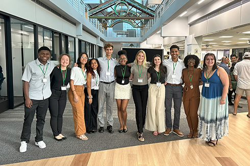 The Making Waves cohort celebrates after presenting their research posters at the USF St. Petersburg Undergraduate Research Symposium at the Nelson Poynter Memorial Library. Photo Credit: Jess Van Vaerenbergh