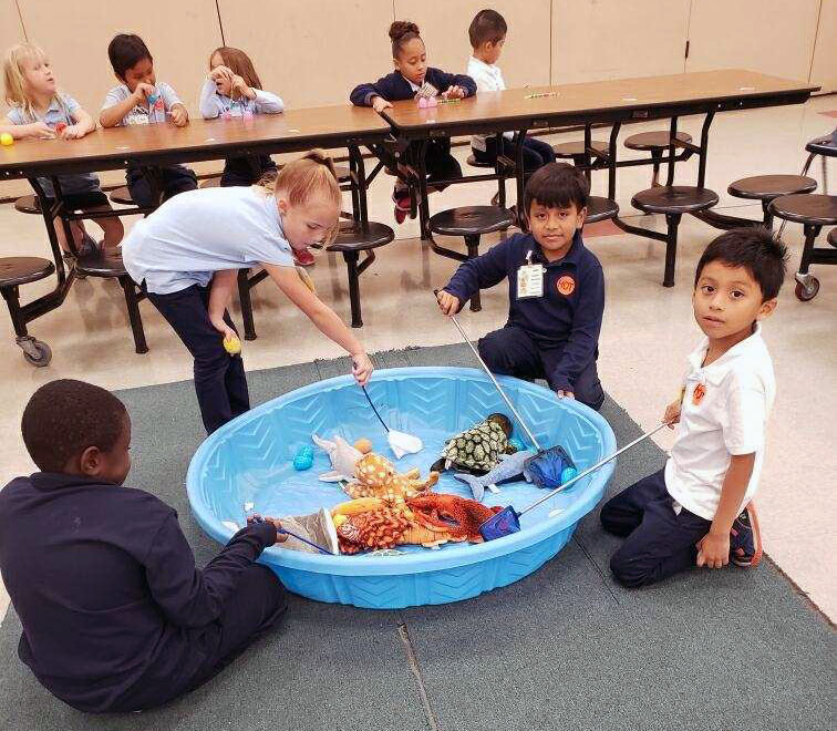 1st graders fishing for their eggs.