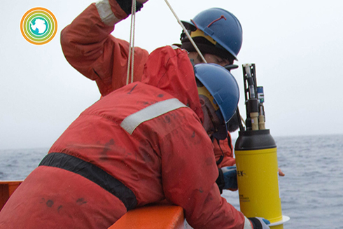 Two scientists deploy a biogeochemical Argo float aboard the R/V Palmer during a research cruise to the Southern Ocean. Photo courtesy of Greta Shum, SOCCOM project.