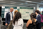 Florida High Tech Corridor CEO Paul Sohl talks to students on the USF St. Petersburg campus during the OneUSF Summer Undergraduate Research Symposium.