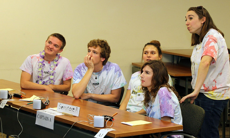 Members of the Seminole High School ‘A team’ review their answers during a break in the action of the Round Robin morning session at the 2019 Spoonbill Bowl. 