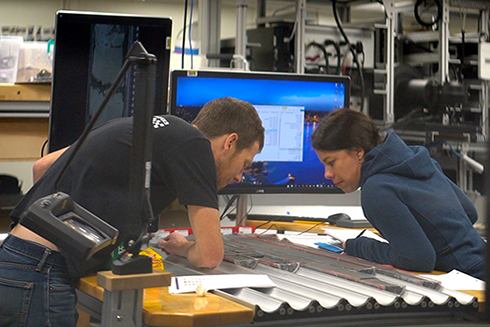 Insights into how the West Antarctic Ice Sheet responded to a warmer climate millions of years ago could improve predictions of its future. Here, USF College of Marine Science Associate Professor, Amelia Shevenell, chief sedimentologist, and Victoria University (NZ) Associate Professor and Antarctic Research Center Director, Rob McKay, co-chief scientist, examine sediment recovered from the Ross Sea during International Ocean Discovery Program Expedition 374 in 2018 (Credit: Mark Leckie)