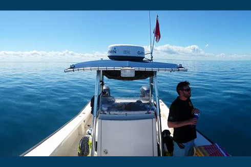 Joshua Kilborn, PhD, on watch offshore Tampa Bay while divers conduct fish surveys for the Fish Ecology Lab.