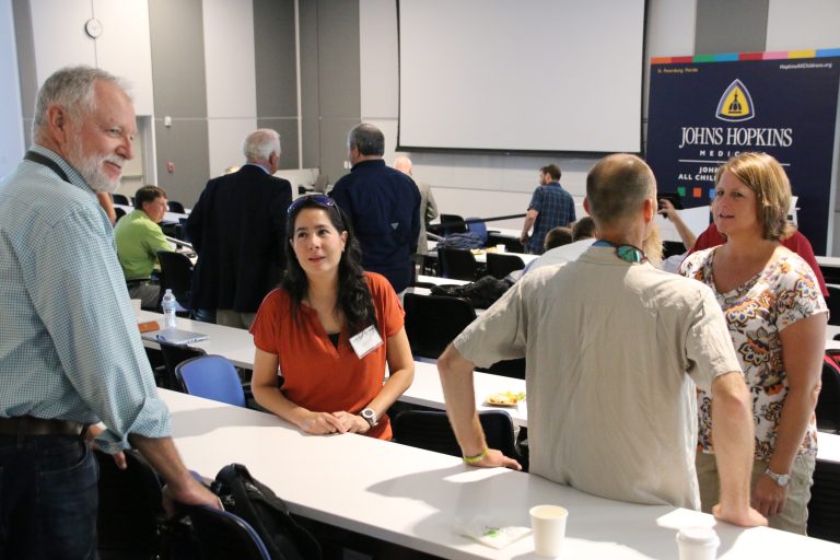 Kevin Shaw, Dr. Isabel Romero, Dr. Daniel Hahn, and Dr. Heather Judkins take advantage of a coffee break to discuss breakout sessions.