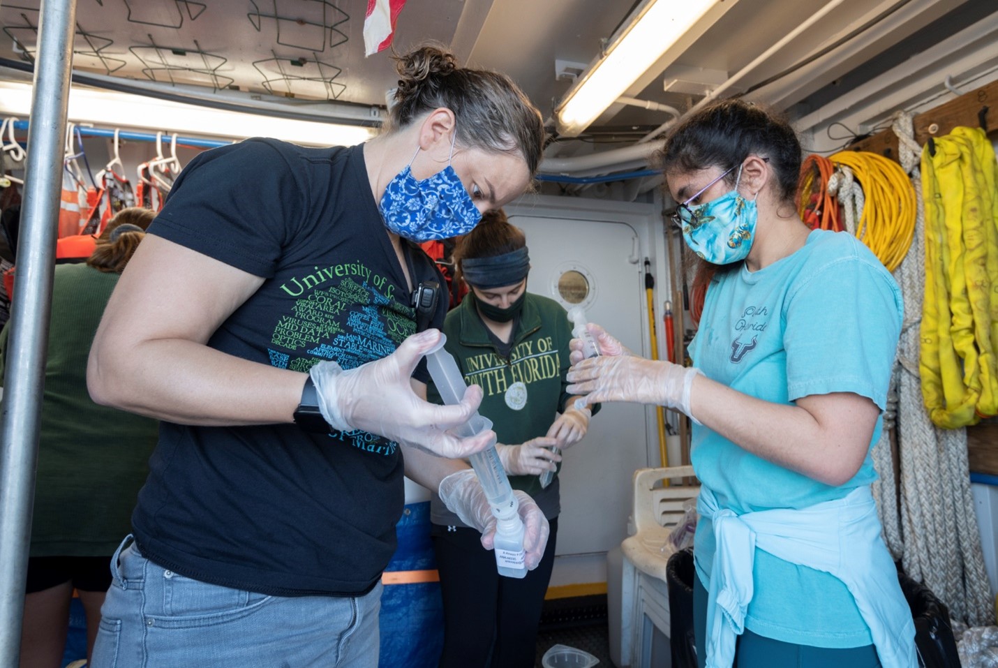 Lead scientist Kristen Buck and team process water samples aboard the R/V Weatherbird II.