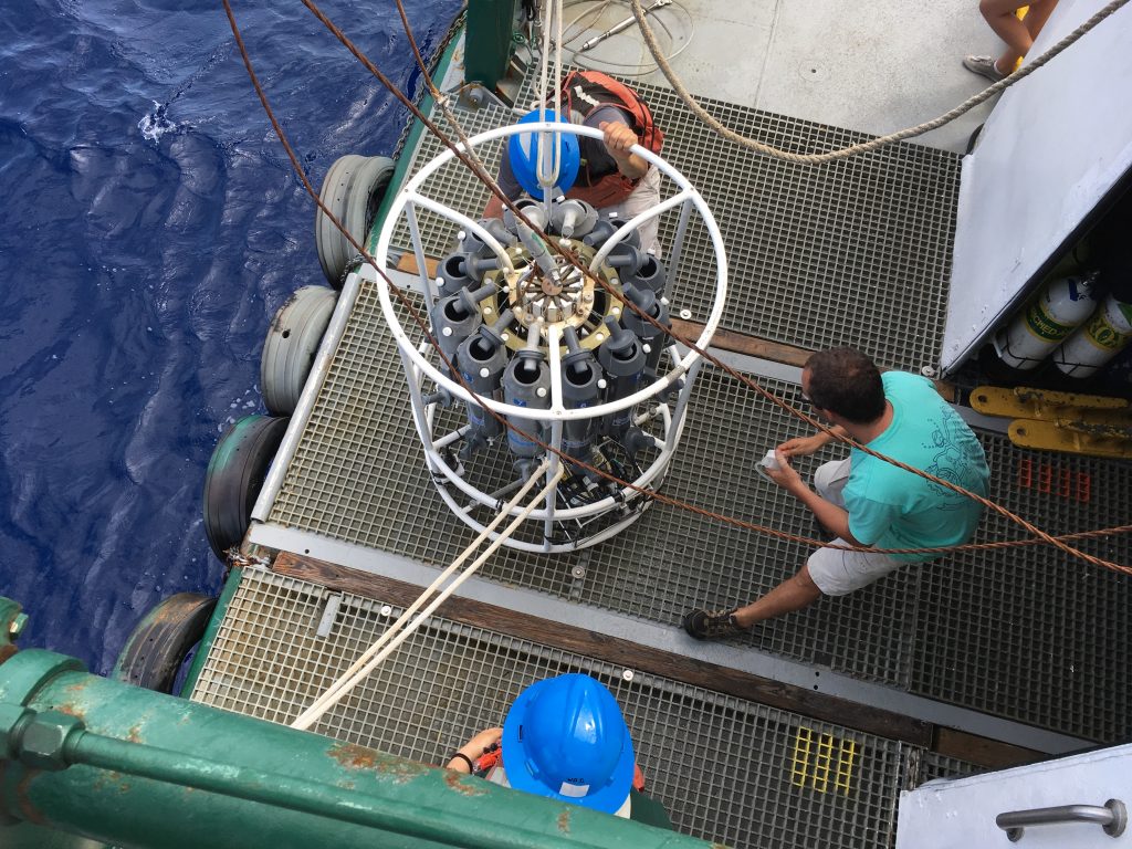 Luis Sorinas Morales examines the Niskin bottles on the rosette ahead of a CTD cast and water sampling.