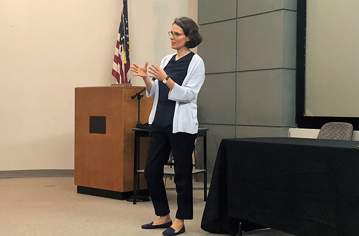 Maria Dornelas, Ph.D., speaking to the audience about gains and losses in biodiversity.