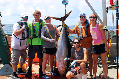 MRA students, faculty, and staff with a yellowfin tuna collected as part of a pelagic longline survey of the Gulf of Mexico conducted aboard the R/V Weatherbird II. From left to right: Ed Hughes, Garrett Miller, Dr. Erin Pulster, Justin Mrowicki, Dr. Steve Murawski, Brigid Carr.