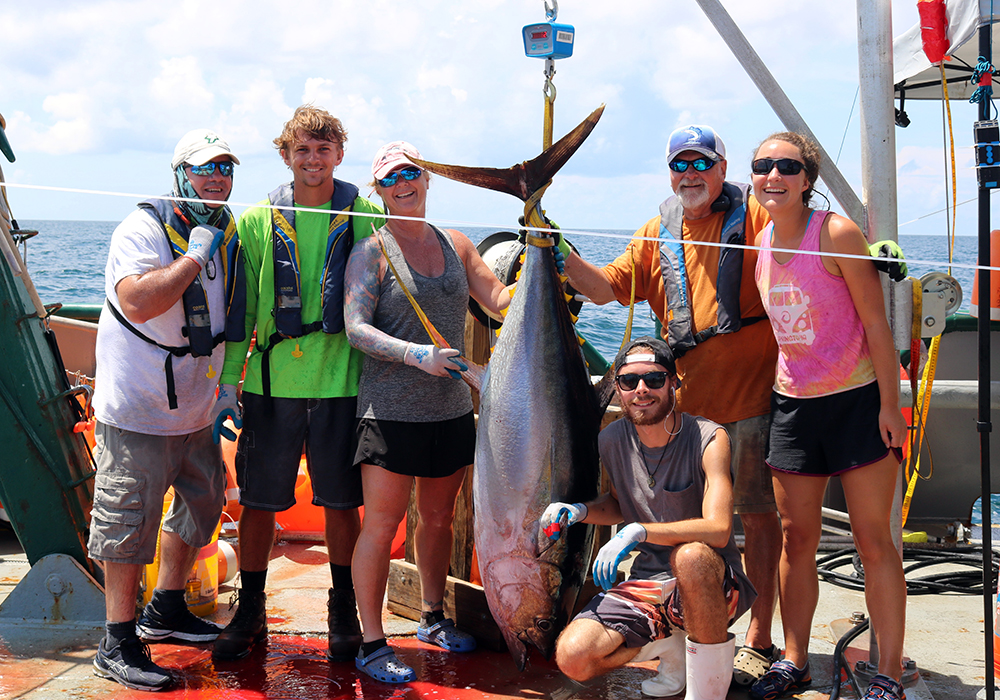 MRA students, faculty, and staff with a yellowfin tuna collected as part of a pelagic longline survey of the Gulf of Mexico conducted aboard the R/V Weatherbird II. From left to right: Ed Hughes, Garrett Miller, Dr. Erin Pulster, Justin Mrowicki, Dr. Steve Murawski, Brigid Carr.