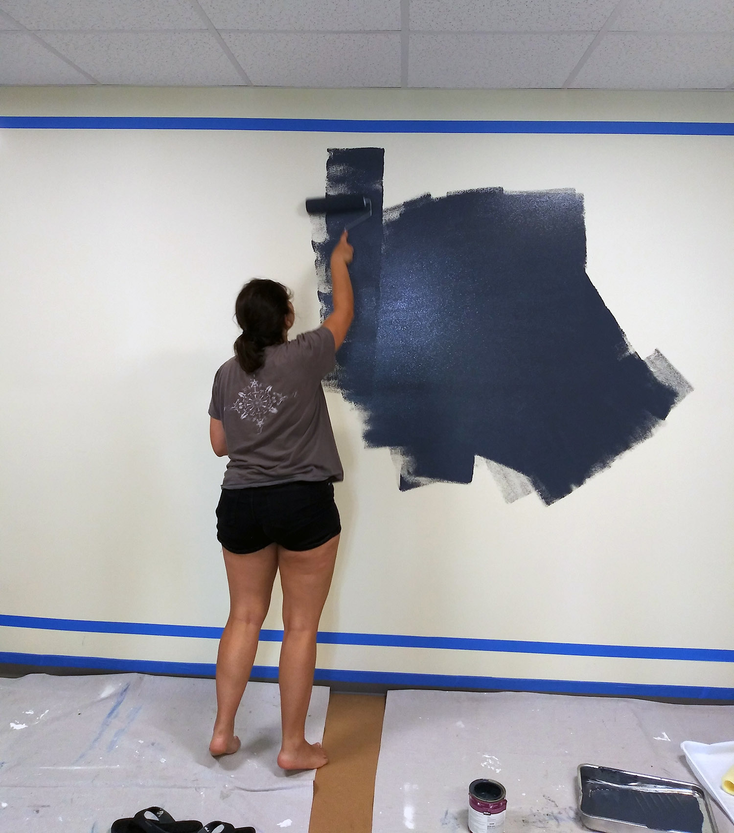 Natalie Sawaya, PhD Candidate puts first paint on the wall