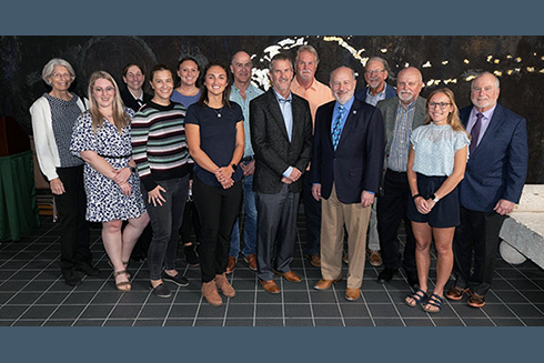 Caption: Left to right are Kendra Daly, Amber Hill (NESDIS Program Coordination Officer), Lieutenant Commander Cherisa Friedlander, NOAA Flag Aide, Kristen Buck, Katelyn Schockman, Catalina Rubiano, Frank Muller-Karger, Tom Frazer, Gary Mitchum, Rick Spinrad, Mark Luther, Steve Murawski, Jill Thompson-Grim, Bob Weisberg.