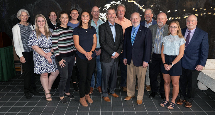 Caption: Left to right are Kendra Daly, Amber Hill (NESDIS Program Coordination Officer), Lieutenant Commander Cherisa Friedlander, NOAA Flag Aide, Kristen Buck, Katelyn Schockman, Catalina Rubiano, Frank Muller-Karger, Tom Frazer, Gary Mitchum, Rick Spinrad, Mark Luther, Steve Murawski, Jill Thompson-Grim, Bob Weisberg.