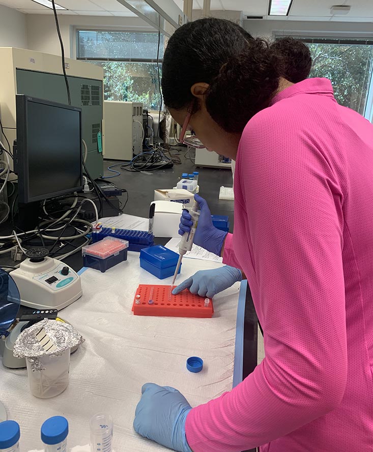 Camper Hana performing a DNA extraction.