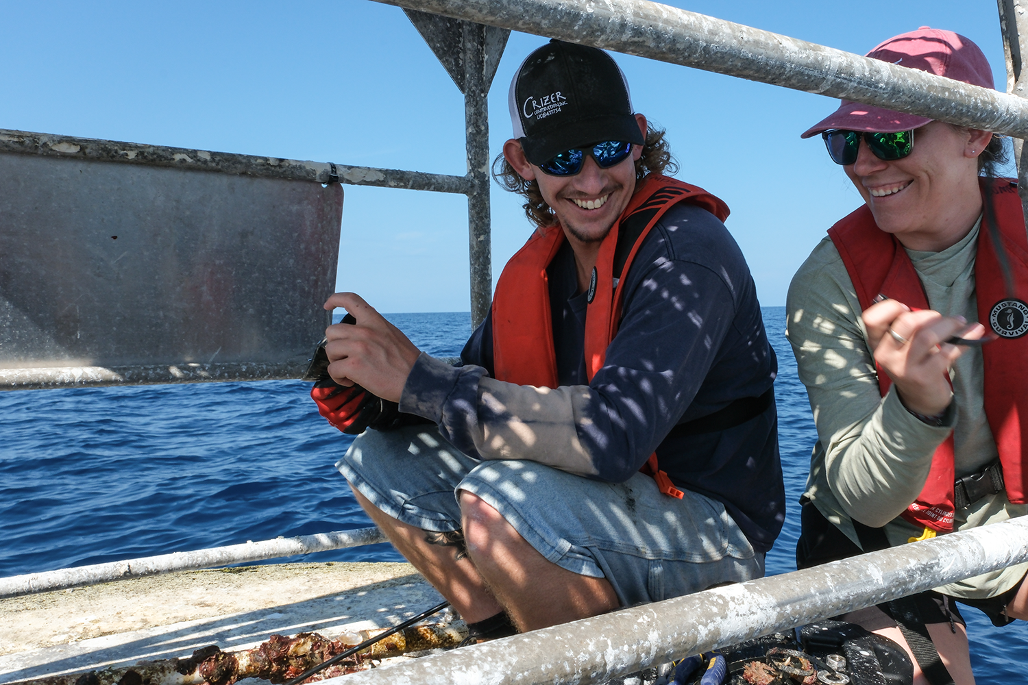 Orion Scharton-Witmer services a buoy with Sam D’Angelo. "She was my mentor alongside Jay and taught me pretty much everything I know about operational mooring work,” he said. Credit: Jackson Sullivan