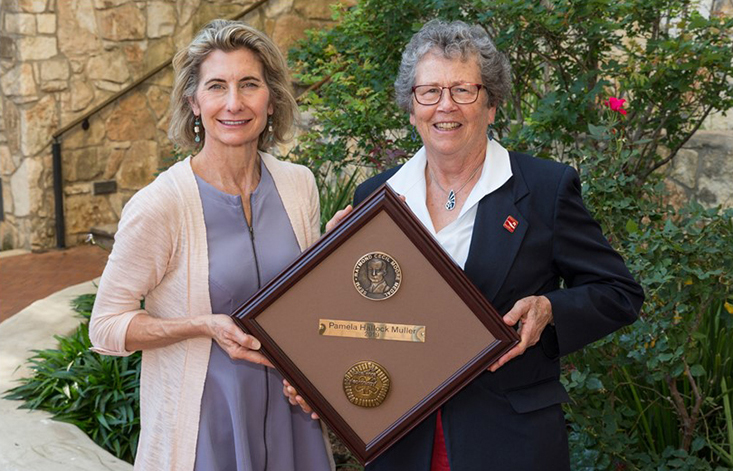 Dr. Pamela Hallock Muller receiving the Raymond C. Moore Medal from Dr. Lynn Soreghan, President of SEPM and James Roy Maxey Professor of Geology at the University of Oklahoma. 