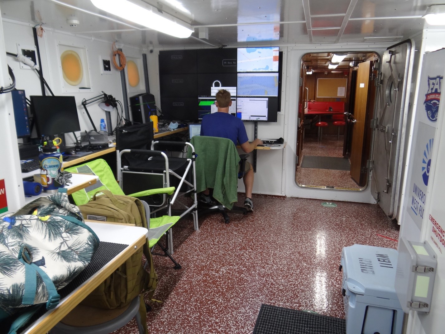 Above: Matthew Hommeyer, COMIT’s Technical Operations Manager, prepares the multibeam echosounder system to collect bathymetry data in the lab aboard the R/V W.T. Hogarth.  
