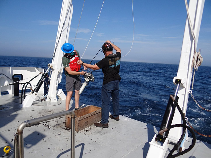 Above: Chief Scientist, Matthew Hommeyer (left), and FIO Science Technician, Andrew Warren, prepare to deploy the underway sound velocity profiler (underway SVP) towfish aboard the R/V W.T. Hogarth in February 2021. 